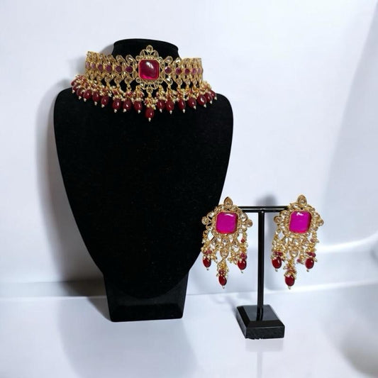 Ruby and fushia kundan bridal choker with gold finish and matching statement earrings